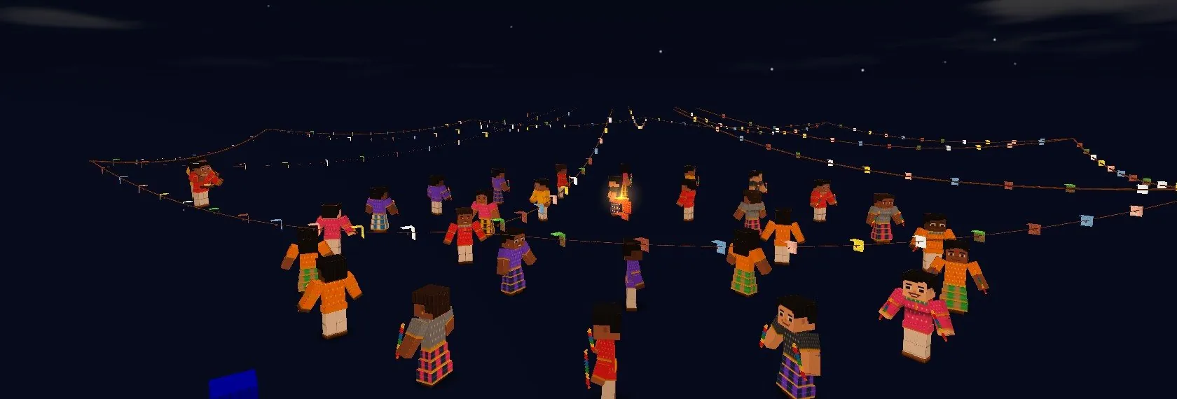 Players dancing garba in two rings under string lights